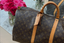 Victoria and David Beckam carrying a Louis Vuitton Keepall bag