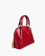 A red Louis Vuitton dome-shaped handbag in glossy embossed patent leather with gold-tone hardware, shown on a plain light gray background.