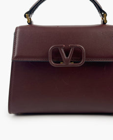 Valentino Garavani VSLING Small Handbag In Burgundy Calfskin
